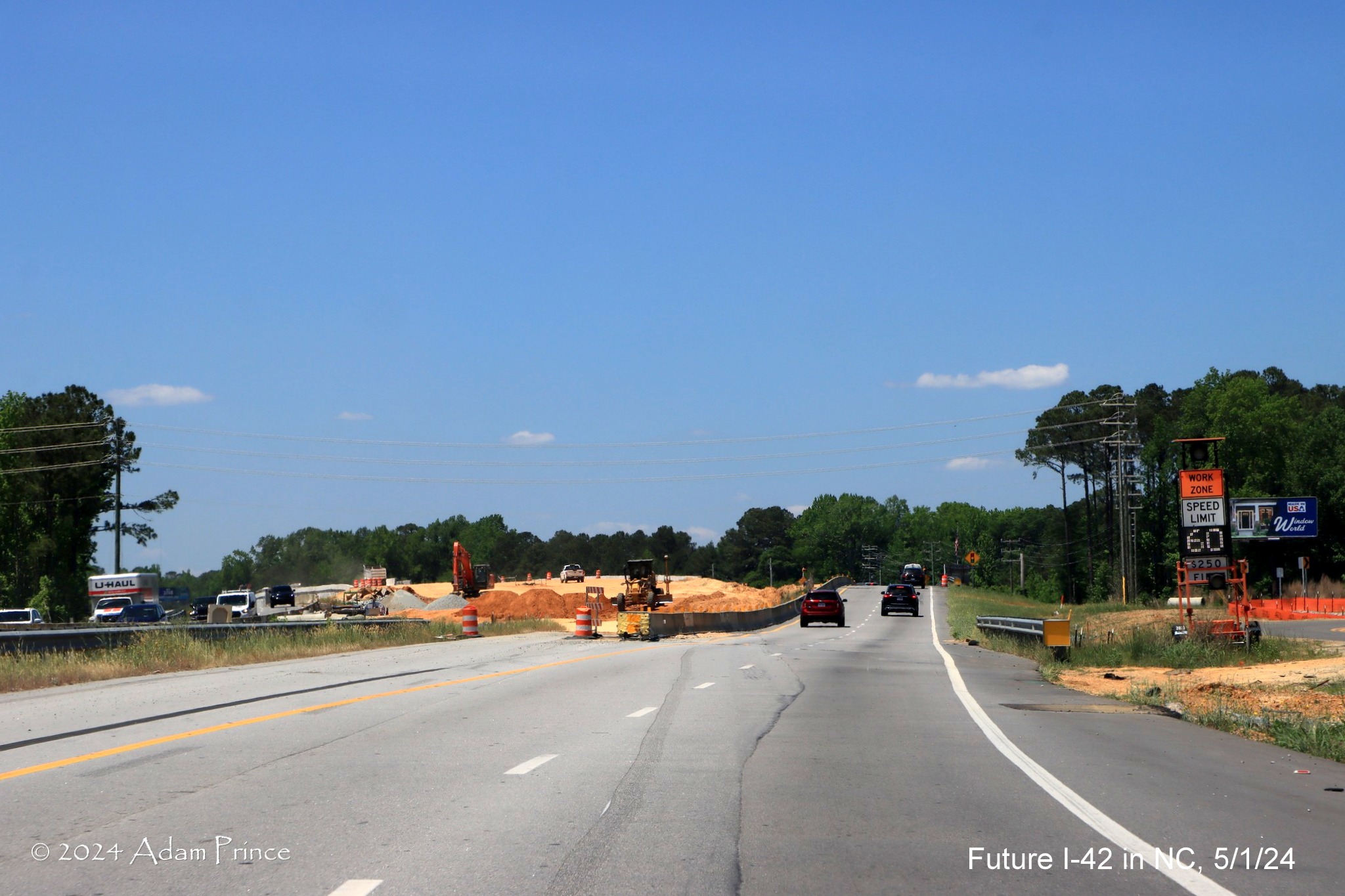 Image of US 70 (Future I-42) West traffic using future exit ramp to
access Wilson's Mills Road intersection, by Adam Prince, May 2024