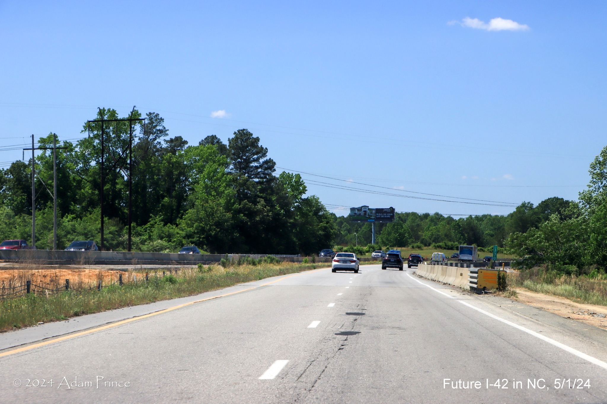 Image of US 70 (Future I-42) West lanes between the Wilson's Mills Road and Swift Creek Road
intersections, by Adam Prince, May 2024