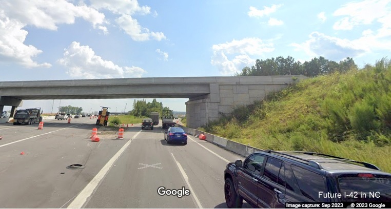 Image of US 70 (Future I-42) East exit ramp from I-40 East in Garner heading under new bridge built
as part of NC 540 construction project, Google Maps Street View, September 2023