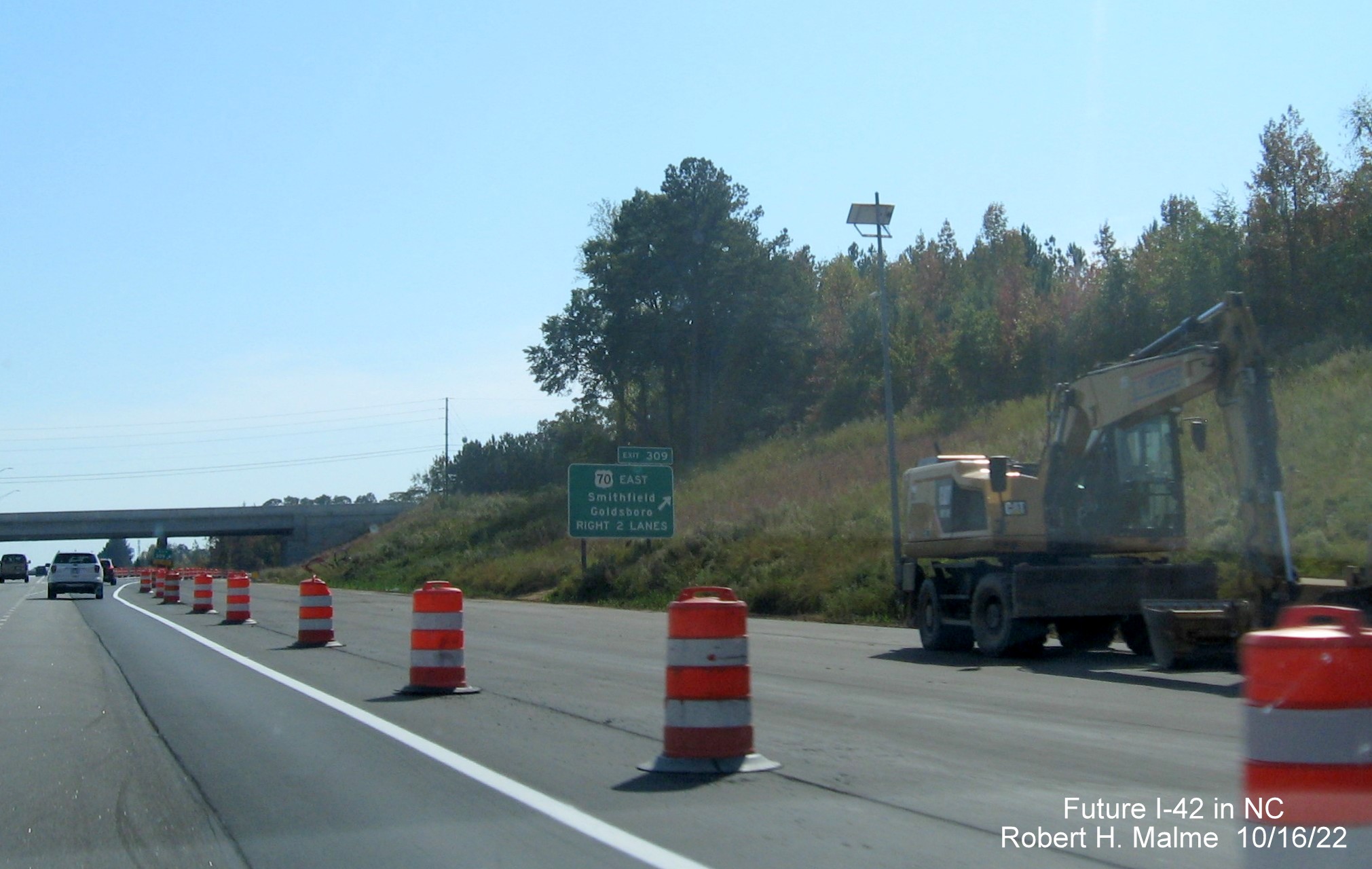 Image of ground mounted ramp sign for US 70 (Future I-42) East Clayton Bypass on I-40 East in widening zone construction area, October 2022