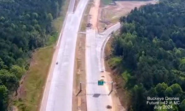 Screen grab image from Buckeye Drones video of new overhead signage with I-40 and US 70 shields on
Future NC 540 East at NC 50 interchange, July 2024