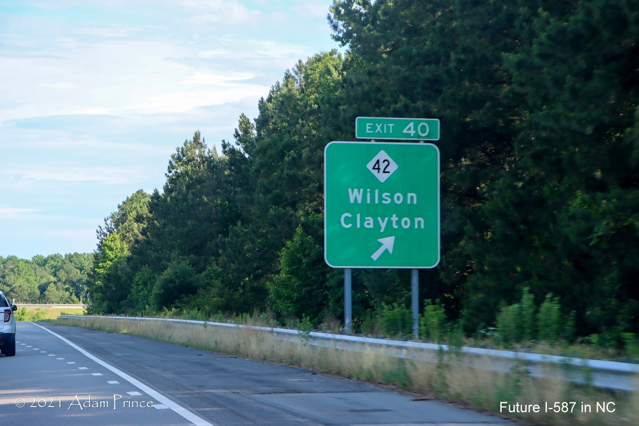 Ground mounted ramp sign for NC 42 exit on US 264 (Future I-587) East in 
	Wilson, photo by Adam Prince, June 2021