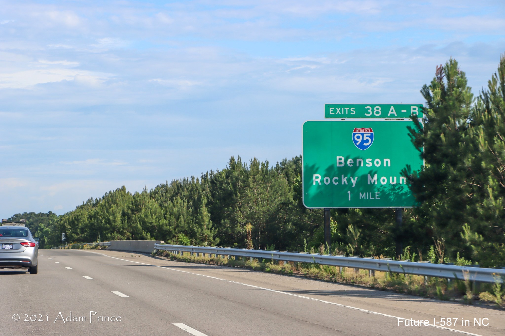 Ground mounted 1 mile advance sign for I-95 exits on US 264 (Future I-587) East 
	in Wilson, photo by Adam Prince, June 2021