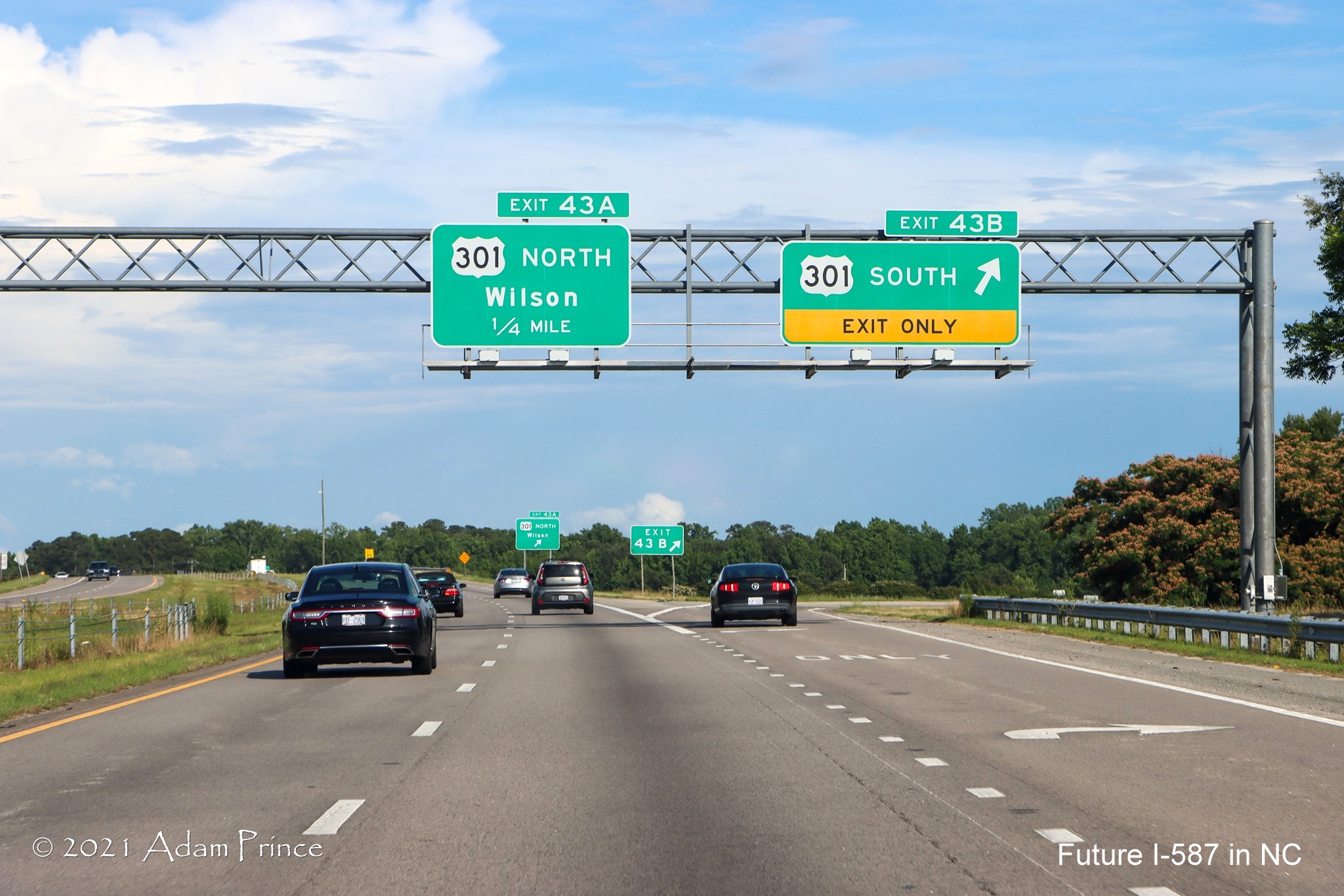 Overhead signage at ramp for US 301 South exit US 264 (Future I-587) West 
	in Wilson, photo by Adam Prince, June 2021