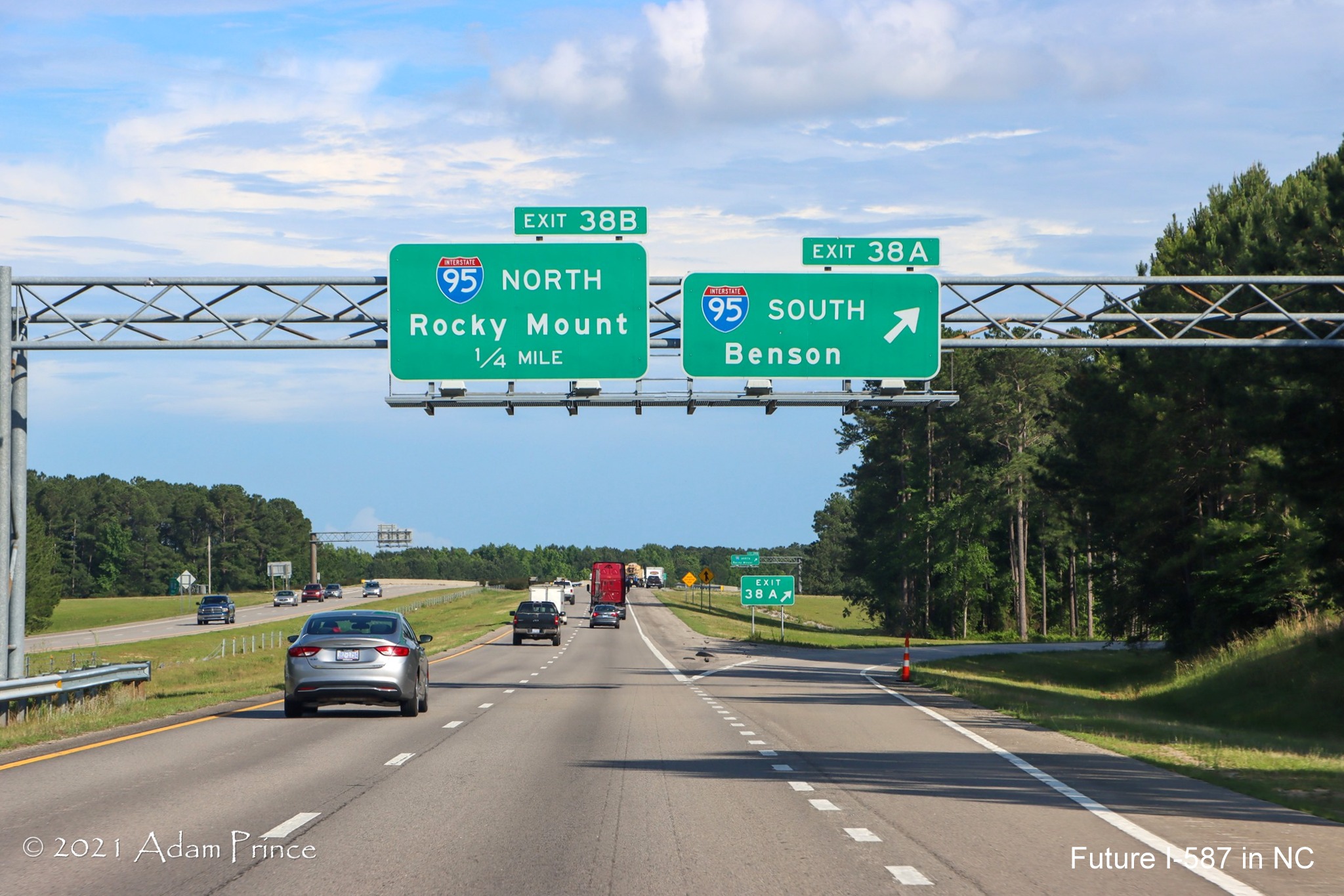 Overhead signage at ramp for I-95 South exit on US 264 (Future I-587) East 
	in Wilson, photo by Adam Prince, June 2021