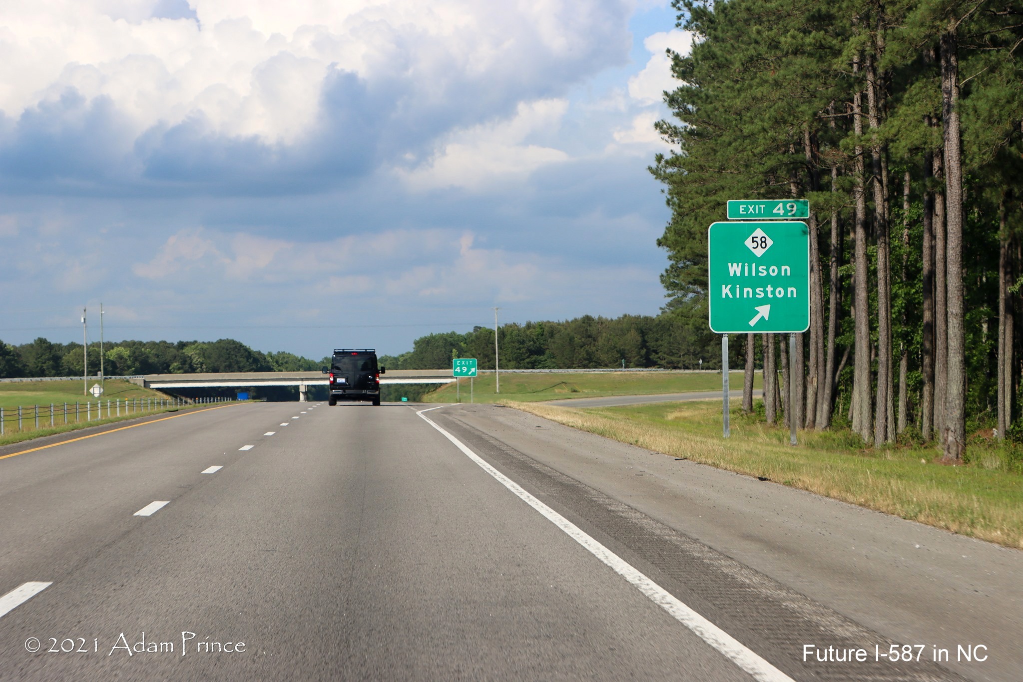 Ground mounted ramp sign for NC 58 exit on US 264 East (Future I-587 East) 
	in Wilson, photo by Adam Prince, June 2021