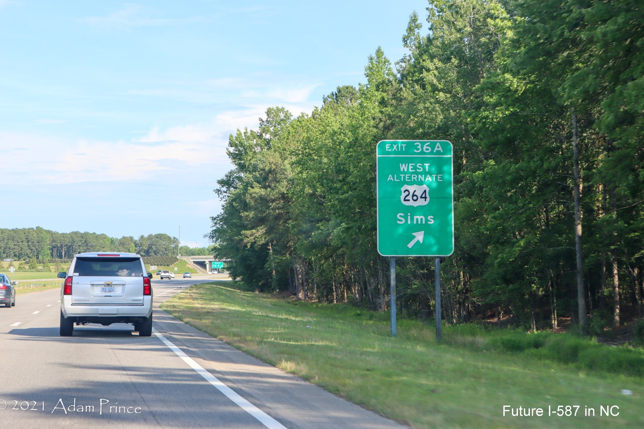 Ground mounted ramp sign for West US 264 Alternate exit on US 264 (Future I-587) East
	 in Sims, photo by Adam Prince, June 2021