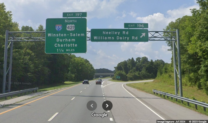 Image of overhead ramp advance sign for new Neelley Road/Williams Dairy Road 
	  exit on US 421 (Future I-685) North in Greensboro, Google Maps Street View, July 2024