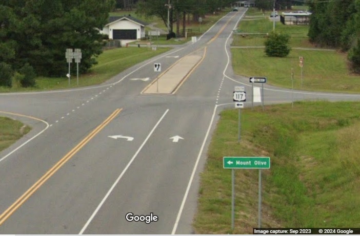 Image of South US 117 ramp signage from Country Club Road bridge in Goldsboro, Google Maps Street View, September 2023