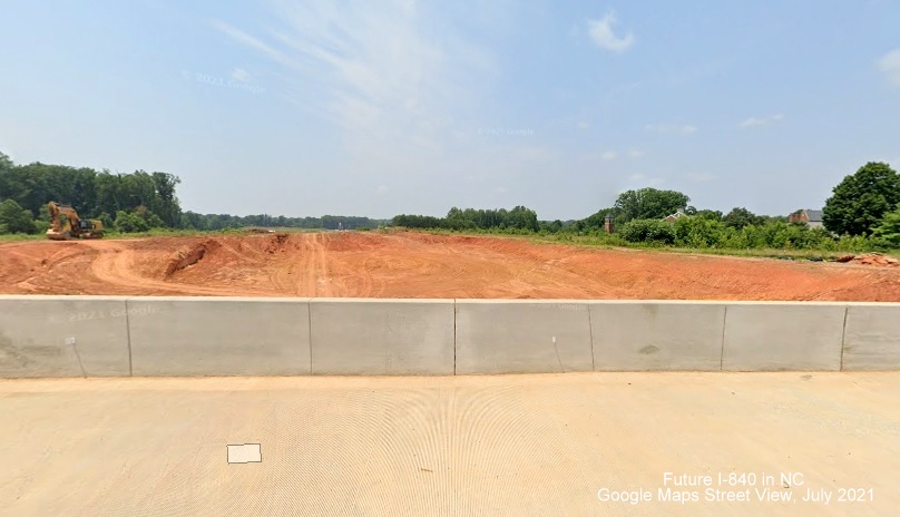 Image of view looking west toward North Elm Street from completed North Church Street bridge over Future I-840/Greensboro Loop, Google Maps Street View, July 2021
