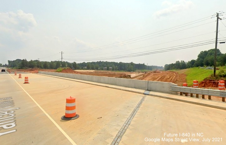 Image looking west across newly completed Yanceyville Street bridge over Future I-840/Greensboro Loop under construction, Google Maps Street View, July 2021