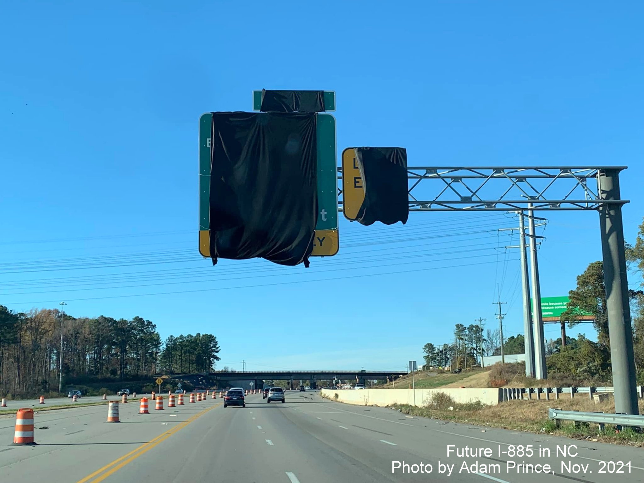 Image of covered over overhead signs awaiting opening of East End Connector on US 70 West in Durham, by Adam Prince November 2021