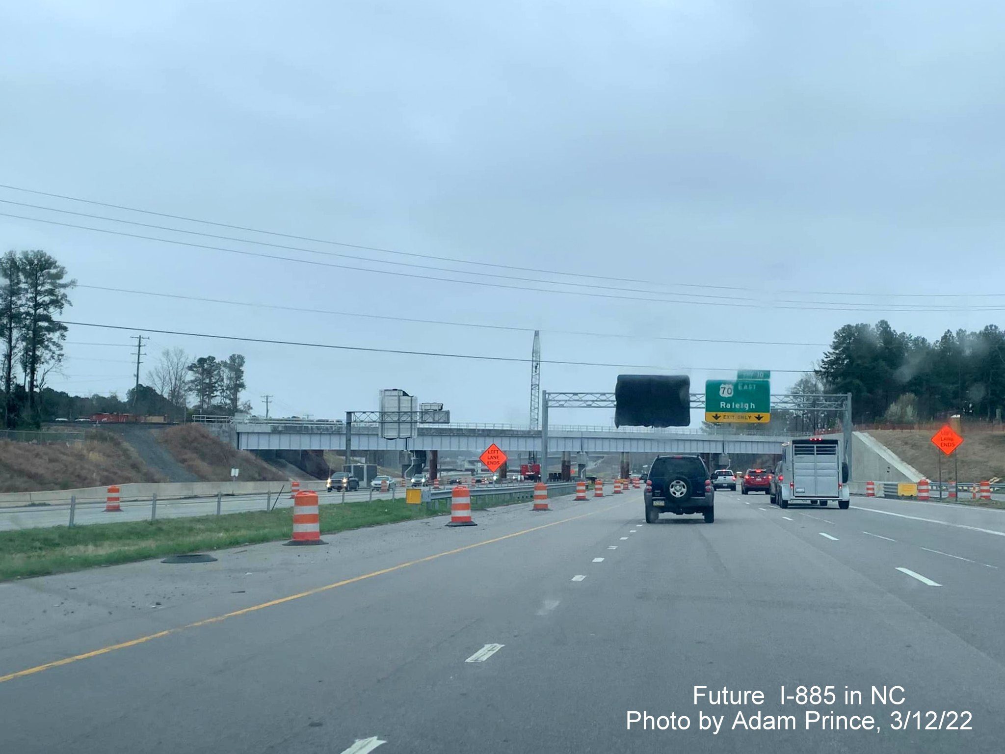 Image of railroad bridge demolition over US 70 (Future I-885) in Durham prior to East End Connector exit, by Adam Prince, March 2022