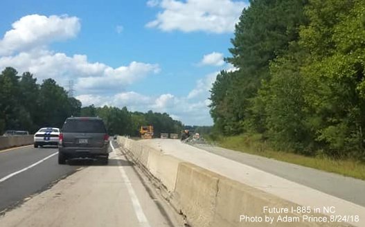 Image of traffic being taken from current NC 147 North lanes to temporary lanes shared with southbound traffic approaching East End Connector interchange, by Adam Prince