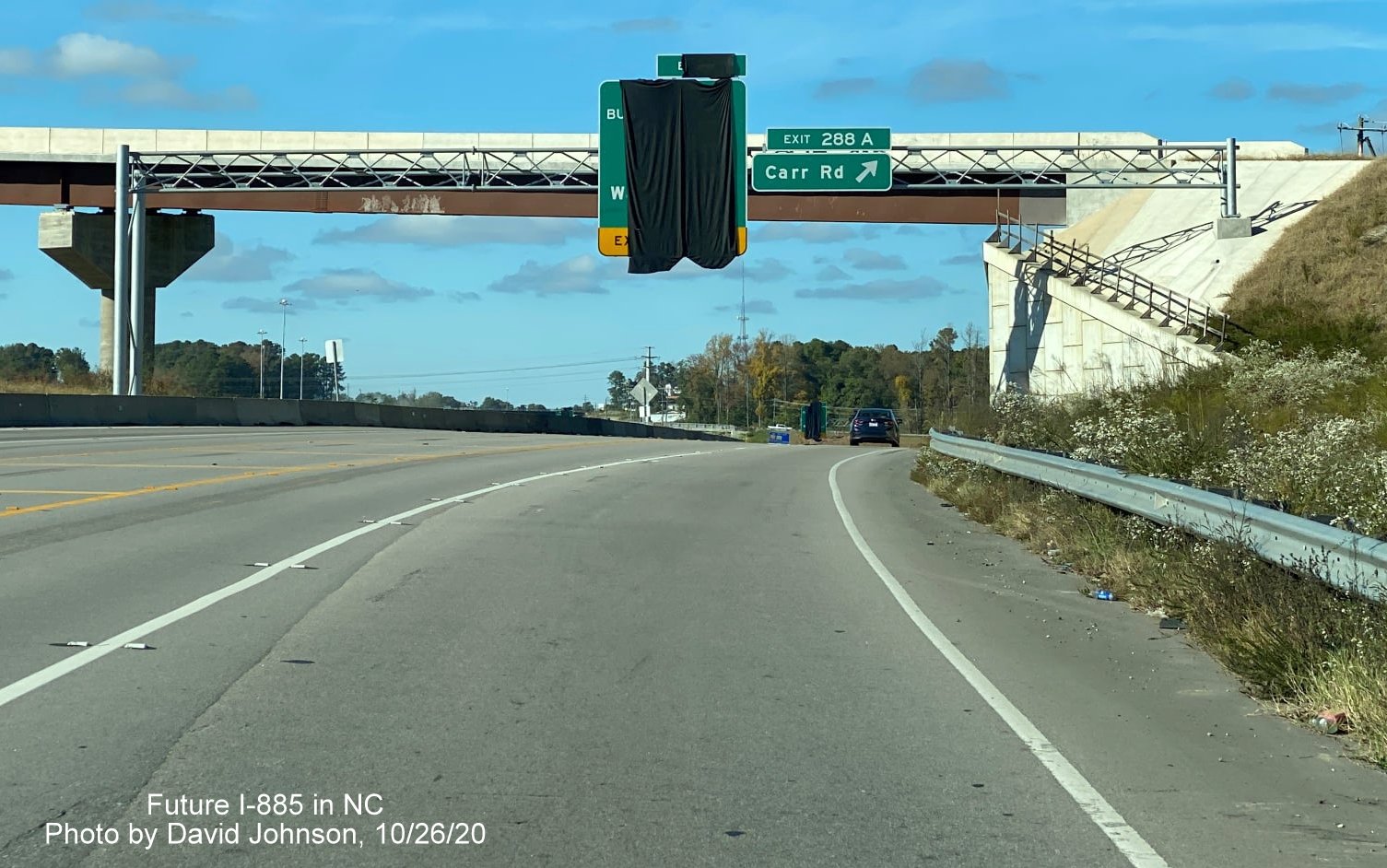 Image of newly placed exit signs along US 70 East prior to Carr Road exit in Durham, by David Johnson October 2020