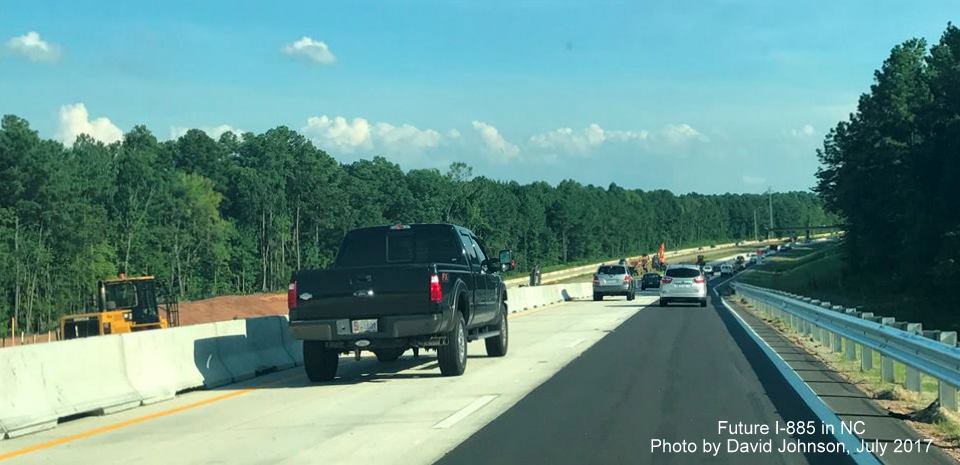 Image of traffic on new NC 147 Southbound lanes near future interchange with I-885, East End Connector in Durham, by David Johnson