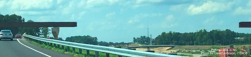 Image showing incomplete flyover ramp with gap over future I-885 roadway looking toward the NC 98 interchange in East End Connector project work zone in Durham, by David Johnson