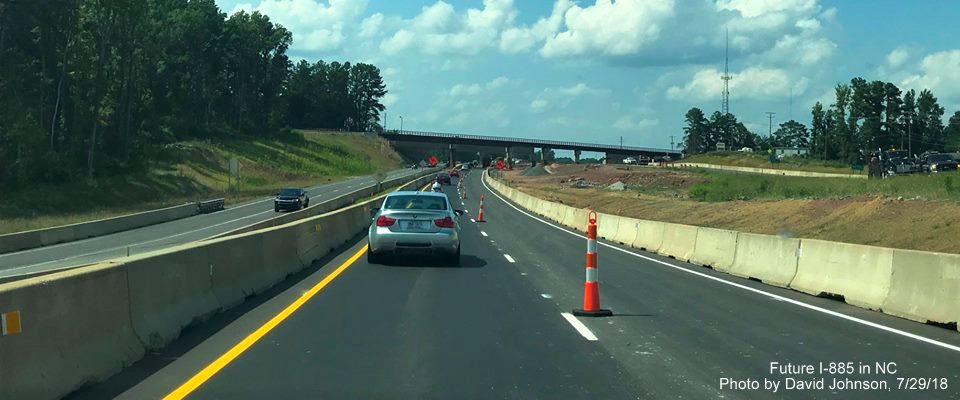 Image of current US 70 West roadway approaching temporary and future railroad bridge over future I-885 roadway in Durham, by David Johnson
