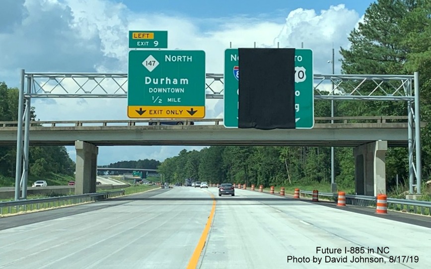 Image of newly placed 1/2 mile advance overhead sign for future NC 147 North exit off of I-885 in East End Connector Project work zone in Durham, by David Johnson