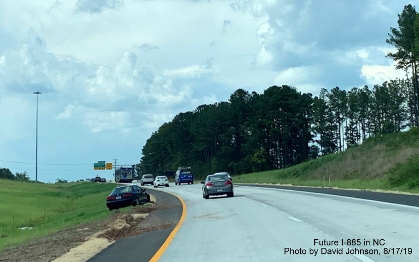 Image of new NC 147 North lanes continuing after passing under Future I-885 ramps in East End Connector interchange in Durham, by David Johnson