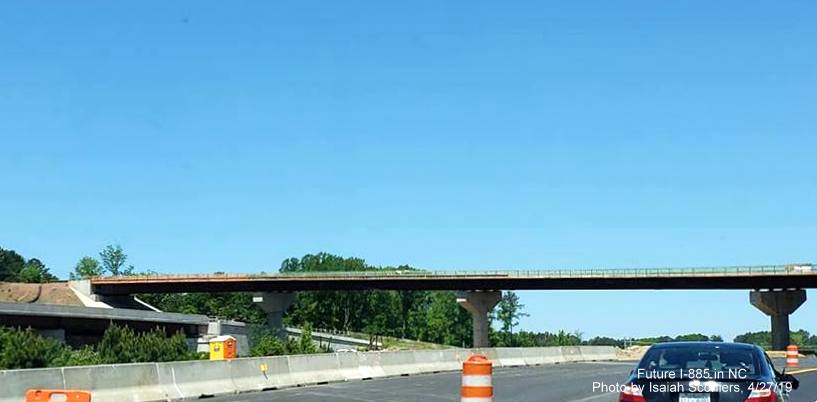 Image of under construction flyover ramp for US 70 East to I-885 South traffic in East End Connector Project work zone in Durham, by Isaiah Sconiers