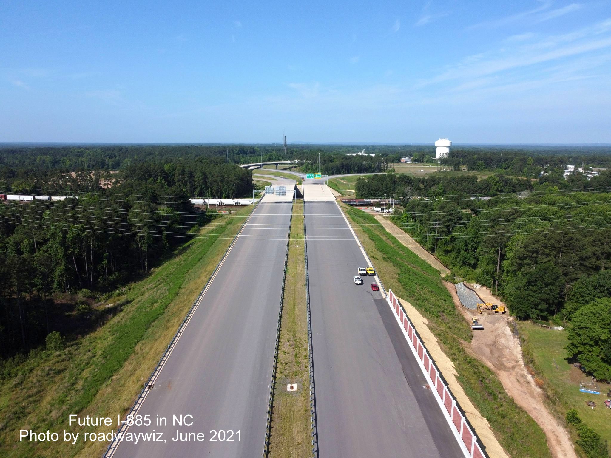 Image taken looking west along unopened I-885/East End Connector toward NC 147 interchange in Durham, by roadwaywiz, June 2021