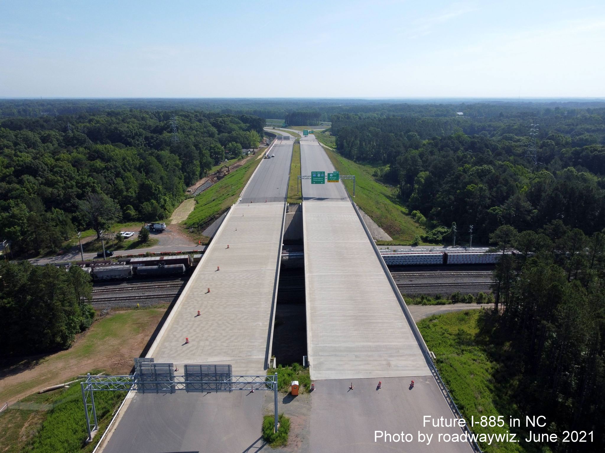 Image taken looking east along unopened I-885/East End Connector toward US 70 interchange in Durham, by roadwaywiz, June 2021
