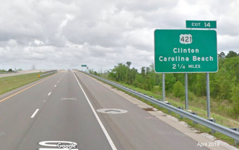 Google Maps Street View image of 2 1/4 miles advance ground mounted sign for US 421 exit on I-140 East, taken in April 2019