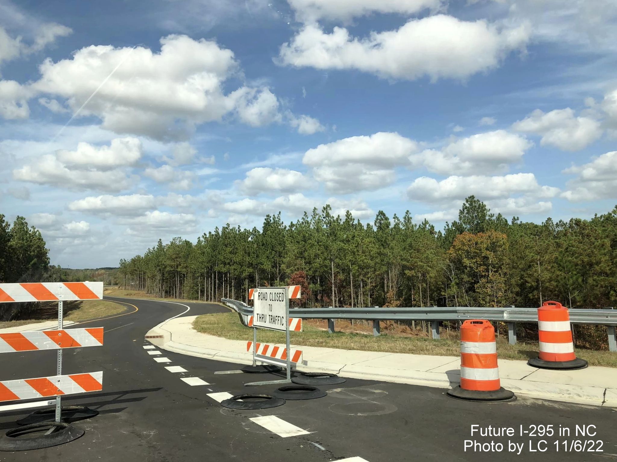 Image taken along new Black Bridge Road roundabout toward closed future ramp to 
        section of Fayetteville Outer Loop, by LC, November 2022
