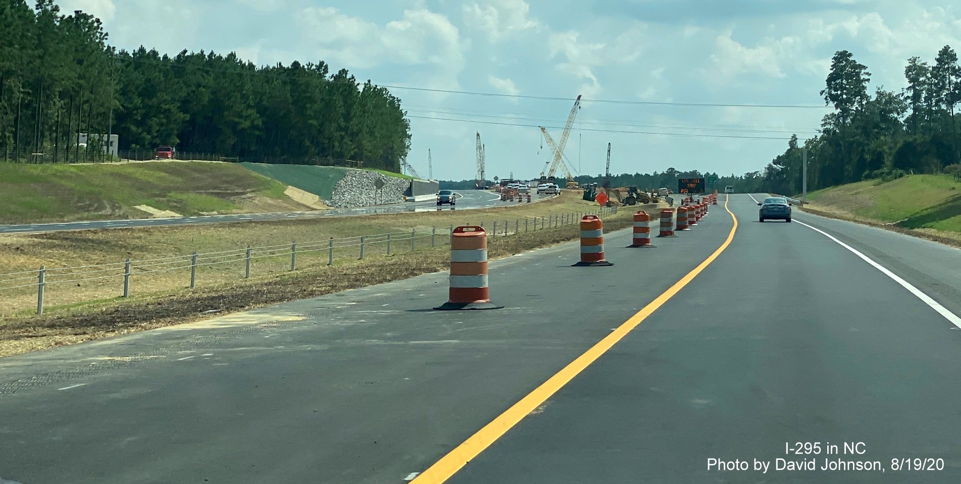 Image of continued Loop construction in median approaching the US 401 exit on Outer Loop/I-295 South in Fayetteville, 
        by David Johnson August 2020