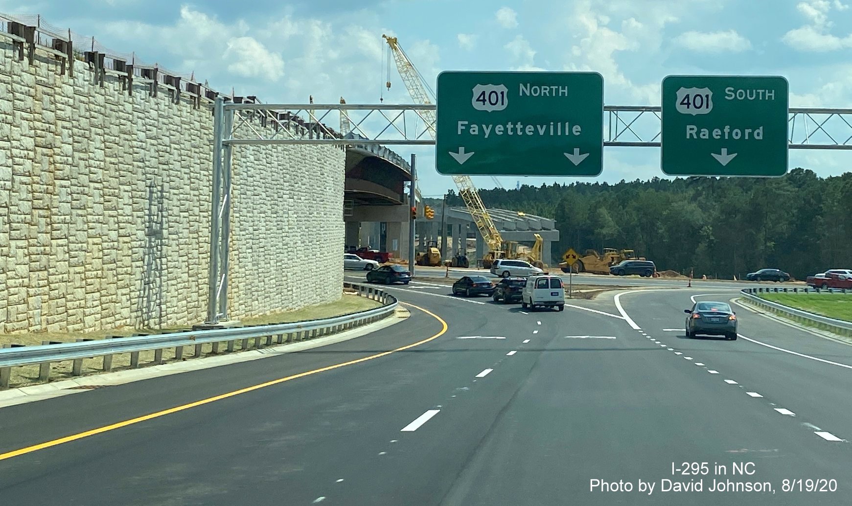 Image of overhead US 401 ramp signs at end of I-295 South in Fayetteville, 
        by David Johnson August 2020