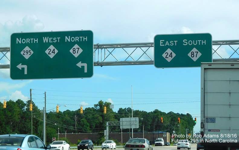 Image of overhead guide signage along Bragg Blvd for Fayetteville Outer Loop, now with NC 295 shield, from 
	Rob Adams