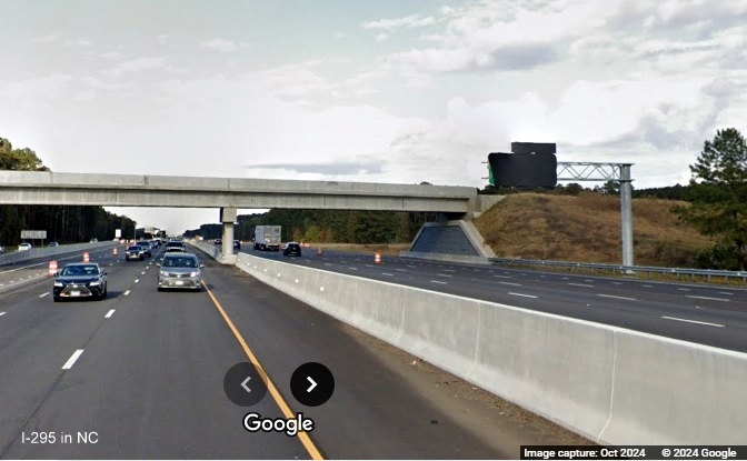 Image of still covered overhead ramp sign for I-295 South exit on I-95 North, 
	  Google Maps Street View, October 2024