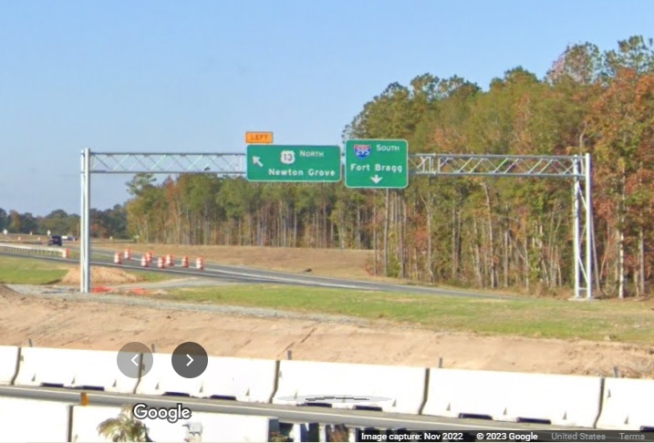 Image of overhead sign for I-295/Fayetteville Outer Loop exit off of I-95 South in Wade, Google 
        Maps Street View, November 2022