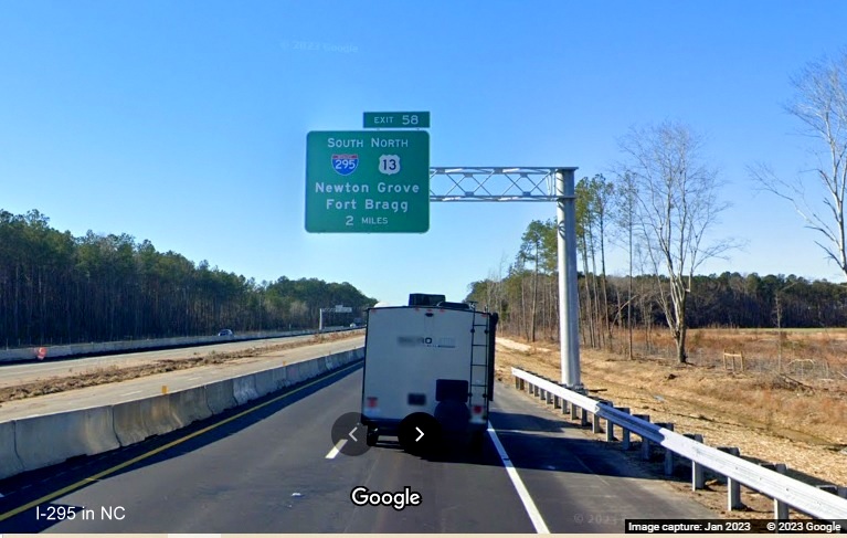Image of newly placed 2 miles advance overhead sign for I-295/Fayetteville Outer Loop exit on I-95 
       South in Wade, Google Maps Street View, January 2023