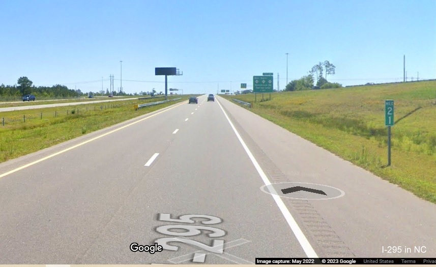 Image of mile marker no longer with I-295 shield at the NC 24/27 Bragg Blvd. interchange, Fayetteville Outer Loop, Google Maps Street View, 
        May 2022