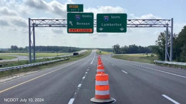 Image of overhead ramp signs at the southern end of the 
	Future I-295/Fayetteville Outer Loop at I-95 in St. Pauls, NCDOT, July 2024