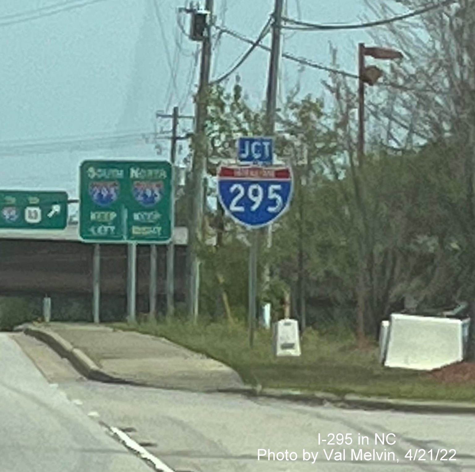 Image of new Junction I-295 trailblazer and guide signs now with I-295 shields on US 401 North near 
       Spring Lake, photo by Val Melvin, April 2022