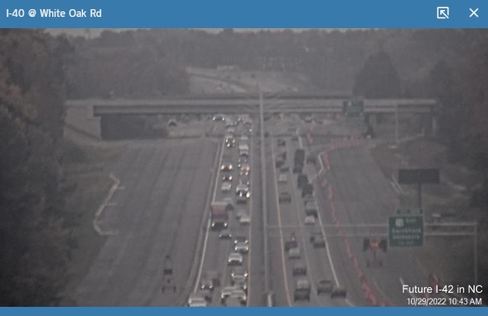 NCDOT traffic camera image showing new overhead signage still showing just US 70 East for Clayton Bypass exit, October 29, 2022