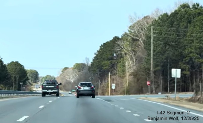 Image of remaining at grade intersection with West Oak Street on US 70 West in Selma,
	screen grab from Benjamin Wolf video, December 2025