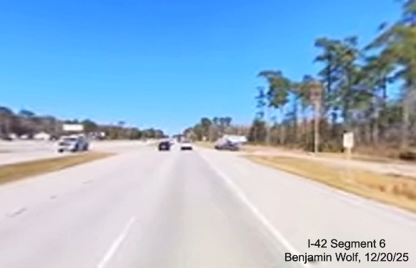 Image of construction along US 70 West at the future Camp Kiro Road exit,
		screen grab from Benjamin Wolf video, December 2025