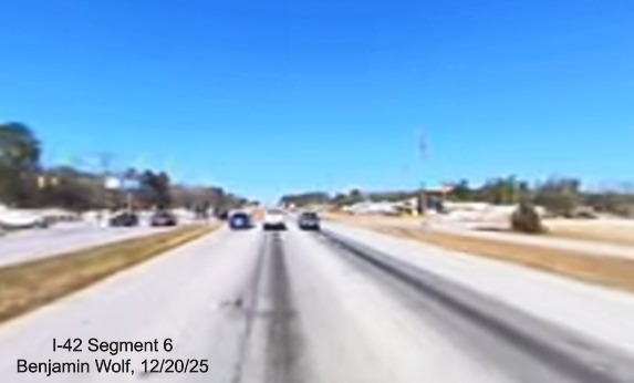 Image of construction along US 70 West at the future Thurman Road exit,
		screen grab from Benjamin Wolf video, December 2025