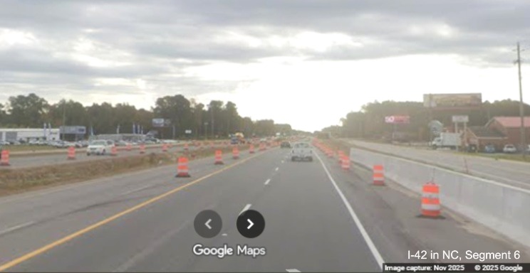 Image of concrete barrier construction on US 70 East in James City after Taberna Way, 
		Google Maps Street View, November 2025