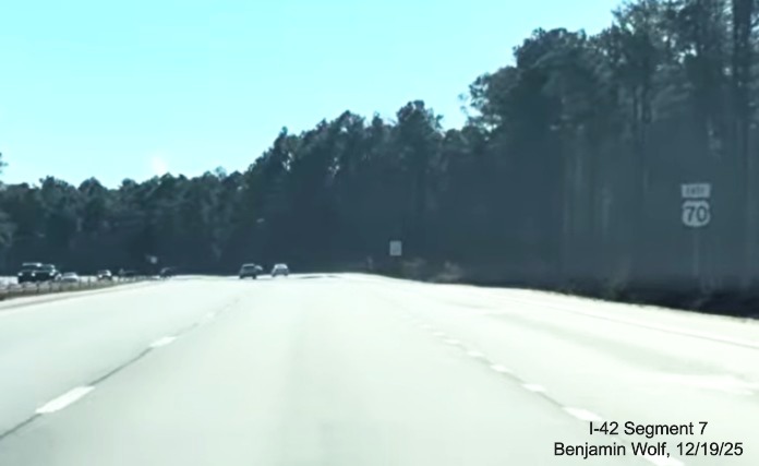 Image of East US 70 reassurance marker near end of interstate standard roadway after
	the end of the US 70 (Future I-42) East Havelock Bypass, Screen grab from Benjamin Wolf video, December 2025