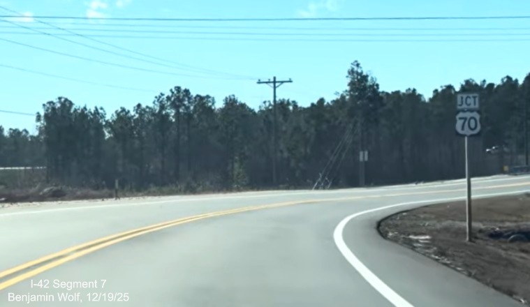 Image of Jct US 70 trailblazer on Lake Road heading north prior to new interchange
	with the US 70 (Future I-42) Havelock Bypass, Screen grab from Benjamin Wolf video, December 2025
