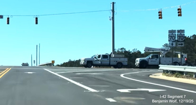 Image of US 70 trailblazers on Lake Road heading north at new interchange
	with the US 70 (Future I-42) West Havelock Bypass, Screen grab from Benjamin Wolf video, December 2025