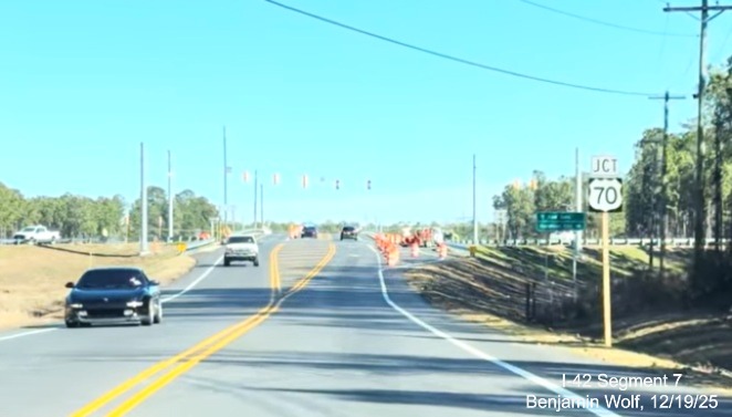Image of Jct US 70 trailblazer on Lake Road heading south prior to new interchange
	with the US 70 (Future I-42) East Havelock Bypass, Screen grab from Benjamin Wolf video, December 2025