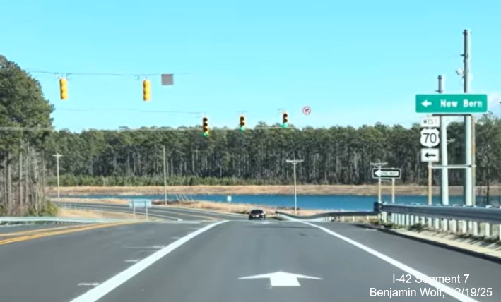 Image of West US 70 trailblazer on Lake Road heading south with new destination sign
	at new interchange with the US 70 (Future I-42) West Havelock Bypass, Screen grab from Benjamin Wolf video, December 2025