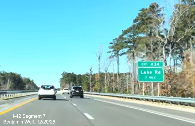 Image of 1 Mile advance sign for Lake Road exit on US 70 (Future I-42) West 
	Havelock Bypass, Screen grab from Benjamin Wolf video, December 2025