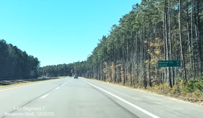 Image of post-interchange distance sign for Morehead City and Beaufort on US 
	70 (Future I-42) East Havelock Bypass, Screen grab from Benjamin Wolf video, December 2025